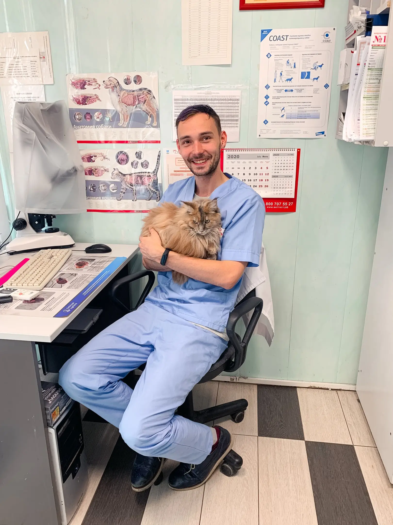 Dr. Strelkov with a cat during an in-clinic check
