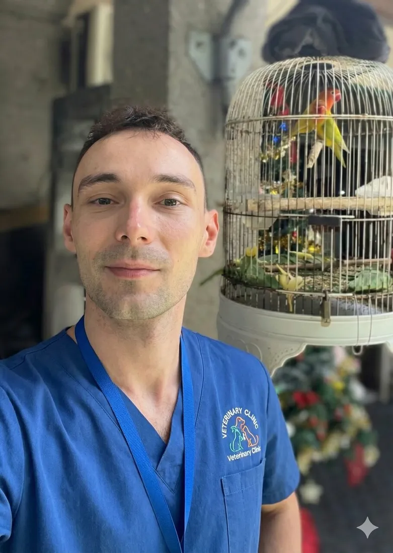 Dr. Strelkov beside an aviary of parrots